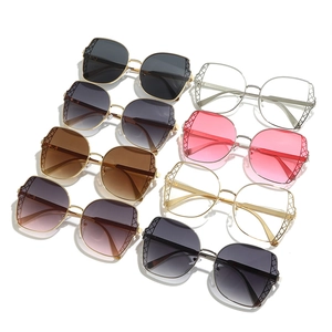 Fashionable oversized metal sunglasses with hollow mesh frame design and gradient lenses