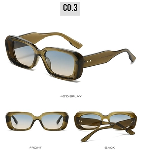 Detail view of square sunglasses with olive green frame and blue to orange gradient lenses