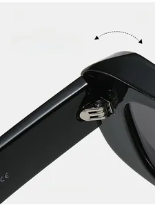 Detail of durable silver metal hinge on black square sunglasses with CE mark