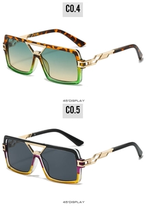 Detail of square oversized sunglasses with gold geometric hollow temples and gradient lenses