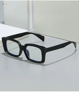 Close-up of black square frame glasses with anti-blue light lenses on a clean background