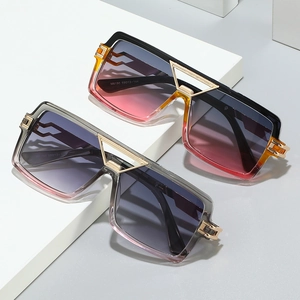 Fashionable oversized square sunglasses with two-tone frames and geometric gold bridge detail