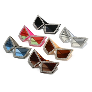 Oversized cat-eye sunglasses with rhinestone frames in six assorted colors on white background