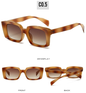 Detail view of retro square tortoise sunglasses with brown gradient lenses and wide frame