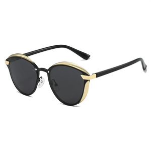 Women's vintage polarized cat-eye sunglasses with black frame and gold metal accents
