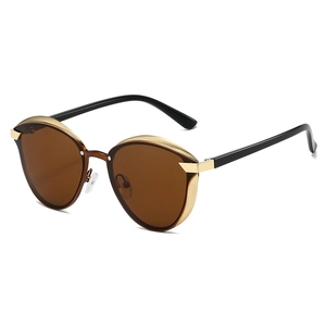 Polarized cat-eye sunglasses with brown lenses and golden vintage metal accents