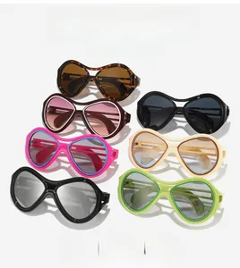 Collection of oversized cat-eye sunglasses in various colors including leopard and neon green