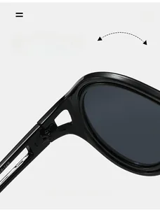 Macro view of durable metal hinges and engraved inner temple on black cat eye sunglasses