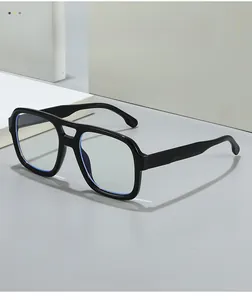 Detailed view of black square double-bridge glasses on a minimalist geometric stand