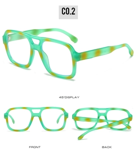 Detail view of square glasses frames in translucent green with orange leopard pattern
