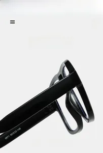 Macro detail of black thick frame eyewear hinges and temple size specifications