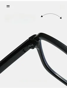 Close-up of durable metal hinge detail on glossy black double-bridge eyewear frame
