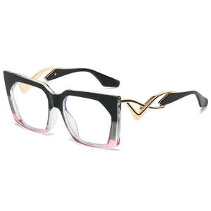 Lunettes de soleil œil-de-chat tendance avec monture dégradée et branches dorées ondulées