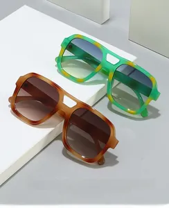 Detail view of retro square tortoise shell sunglasses with premium acetate frames and dual bridge