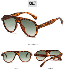 Detail view showing front and side of tortoiseshell aviator sunglasses with gradient lenses