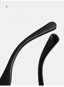 Detail shot of curved mirror legs on black oversized sunglasses for comfortable wear