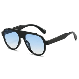 Modern oversized black frame sunglasses with light blue gradient lenses on white background