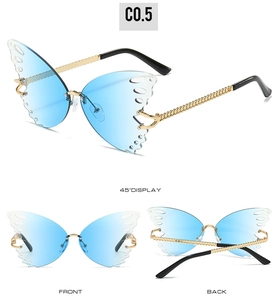 Detail view of butterfly rimless sunglasses with blue gradient lenses and gold chain temples