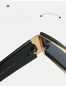 Detailed macro view of durable golden metal hinge on trendy black square sunglasses