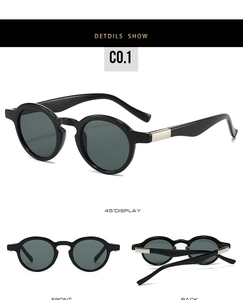 Close-up of black retro round frame sunglasses with silver metal temple decoration