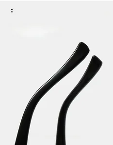 Detailed macro view of ergonomic curved glossy black temple tips for comfortable fit