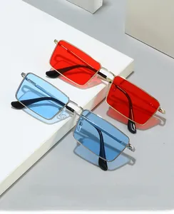 Detail of square metal frame sunglasses in red gold and blue silver combinations