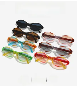 Flat lay of retro oval sunglasses set in multiple colors like black, tortoiseshell and blue