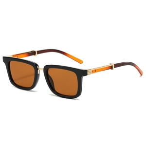 Retro square sunglasses with black frames, amber lenses and gold textured metal temples