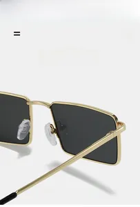 Detailed close-up of golden metal frame square sunglasses with soft silicone nose pads