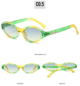 Detail view of oval sunglasses with yellow-green gradient lenses and Atalska logo