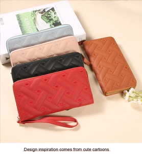Detailed macro view of quilted PU leather wallets with elegant heart embroidery patterns