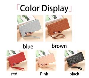 Detailed color display of quilted heart pattern zip-around wallets with wristlet straps