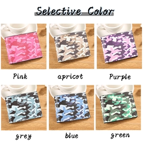 Six camouflage bifold wallets in pink, apricot, purple, grey, blue, and green on a desk