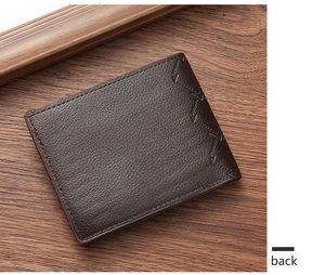 Detail view of dark brown pebbled PU leather men's bifold wallet back side on wood