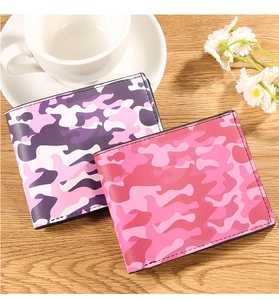 Detail of short bifold wallets featuring camouflage patterns in purple and pink tones