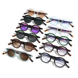 Collection of retro round sunglasses and frames in assorted colors on white background