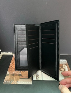 Classic black men's long bifold wallet with multiple card slots and clear ID window
