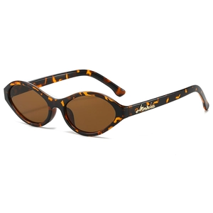Retro tortoise oval sunglasses with brown lenses and gold logo detail on white background