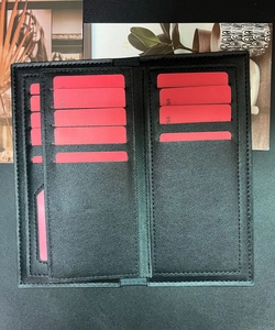 Detailed interior of men's long leather wallet with multiple card slots and pebble texture