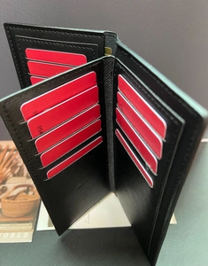 Detailed view of long leather wallet with accordion style slots and multiple card storage