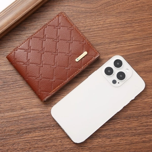 Brown bifold wallet for men with geometric pattern and logo on dark wooden background