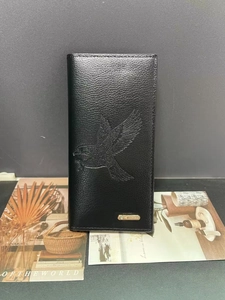 Men's black leather long wallet featuring a large embossed eagle and gold brand logo