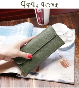 Close-up of grass green litchi texture long wallet in an elegant lifestyle setting