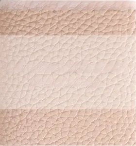 Macro shot of pink lychee texture leather showing soft and flexible material detail