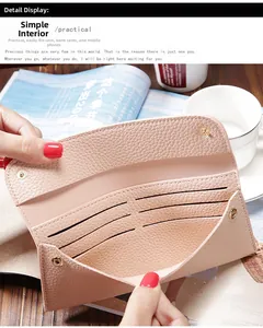 Detailed interior of a pebbled leather long wallet showing card slots and phone pocket