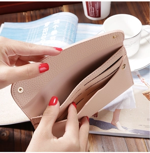 Pink lychee texture long wallet detail showing multiple card slots and interior compartments
