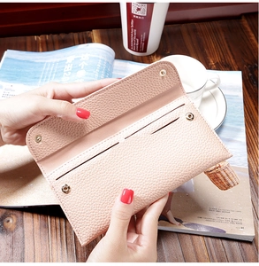 Detailed interior of a beige lychee pattern long wallet showing card slots and compartments