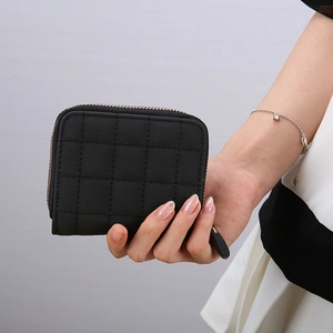 Mini black quilted fashion wallet with classic checkered texture and zipper closure