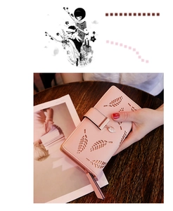 Détail du portefeuille long rose avec motif feuilles ajourées et pendentif en métal