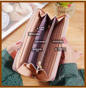 Detail view of pink long wallet interior with card slots and smartphone compartment